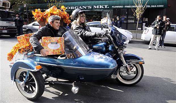 Winemaker Franck Duboeuf arrives in a motorcycle sidecar as he delivers the first case of Georges Duboeuf 2008 Beaujolais Nouveau.